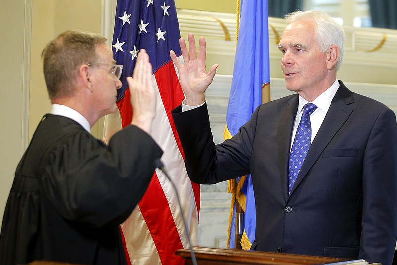 John O’Connor (right) is sworn in Friday as Oklahoma’s new attorney general by state Supreme Court Justice M. John Kane IV at the state Capitol in Oklahoma City.
(AP/The Oaklahoman/Bryan Terry)