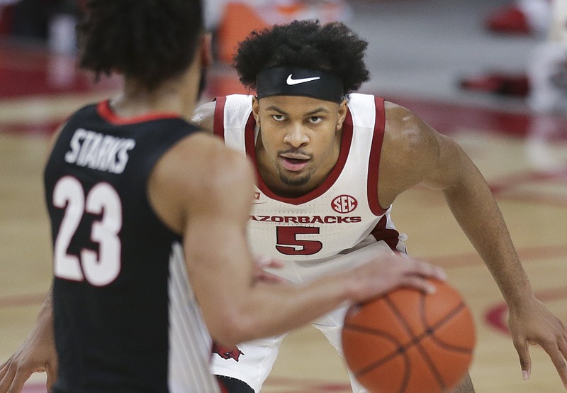 FILE -- Arkansas guard Moses Moody (5) blocks Georgia Mikal Starks (23), Saturday, January 9, 2021 during the first half of a basketball game at Bud Walton Arena in Fayetteville. 
(NWA Democrat-Gazette/Charlie Kaijo)