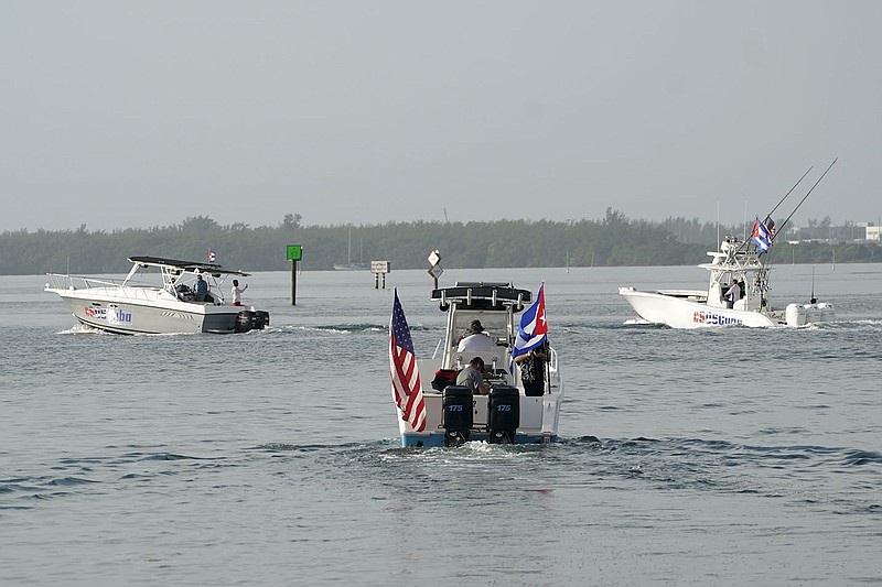 Boats depart Biscayne Bay in downtown Miami on Friday carrying a small group of Cuban Americans toward international waters just off the coast of Cuba, with a fuel stop in Key West.
(AP/Wilfredo Lee)