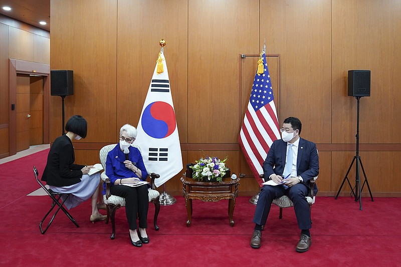 U.S. Deputy Secretary of State Wendy Sherman (second from left) said, “We are looking forward to a reliable, predictable, constructive way forward with the DPRK [Democratic Peoples Republic of Korea],” as she talked to journalists Friday with South Korean First Vice Foreign Minister Choi Jong Kun after their meeting at the Foreign Ministry in Seoul, South Korea.
(AP/South Korea Foreign Ministry)