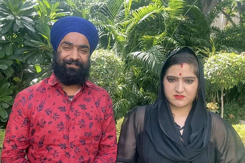 A photo provided by Manjinder Singh Sirsa, the head of the largest Sikh temple, in New Delhi, shows Manmeet Kour Bali (right), with her second husband. Days after appearing in court to defend her conversion to Islam to marry a Muslim man, Bali was married to a Sikh man.
(Manjinder Singh Sirsa via The New York Times)