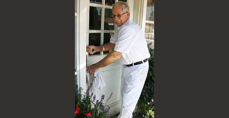 Norman August Klappenbach, who died June 26, is shown locking the bakery doors for the last time Nov. 2, 2011. His wife, Lee Klappenbach, said of this scene: “He seemed very pleased with himself.” 
(Special to The Commercial/Deborah Horn)