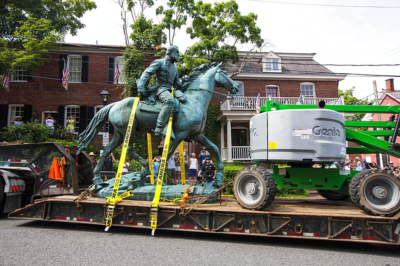 The monument of Stonewall Jackson is hauled away on Saturday, July 10, 2021 in Charlottesville, Va. (AP/John C. Clark)