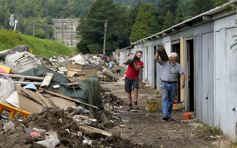 Residents of Trooz, Belgium, clean out household items Tuesday that were damaged by floodwaters.
(AP/Virginia Mayo)