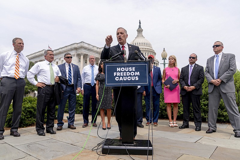 Rep. Andy Biggs, R-Ariz., (center) chairman of the House Freedom Caucus, accompanied by other members of the caucus, speaks Thursday at a news conference on Capitol Hill in Washington to complain about Speaker of the House Nancy Pelosi, D-Calif., and masking policies.
(AP/Andrew Harnik)