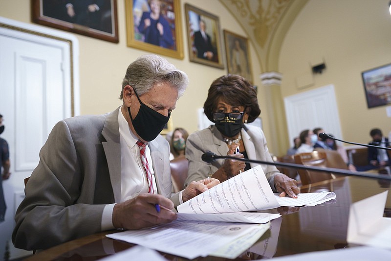 House Energy and Commerce Chairman Frank Pallone (left), D-N.J., and House Financial Services Committee Chairwoman Maxine Waters, D-Calif., go over their notes Friday at the House Rules Committee as they prepare an emergency extension of the eviction moratorium, at the Capitol in Washington.
(AP/J. Scott Applewhite)