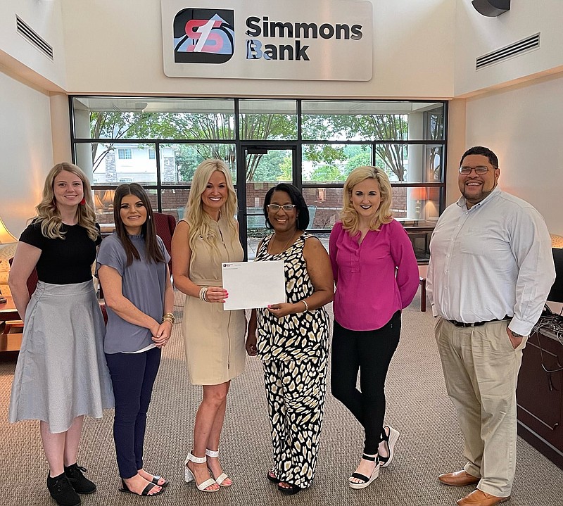 Simmons Bank donated $1,000 to the Southeast Arkansas Financial Education (S.A.F.E.) Center. Participants at the presentation are Jamie Stahley, personal banker (from left); Malorie Goffman, relationship banker; Samantha Robertson, Simmons financial center manager; Clarissa Pace, S.A.F.E. Center founder; Laura Jones, relationship banker; and Chris Allen, S.A.F.E. Center director. 
(Special to The Commercial)