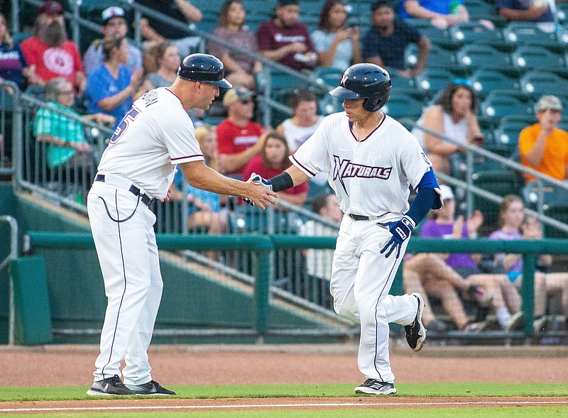 Freddy Fermin (13) of the Naturals hits homerun against Wichita, is congratulated by Scott Thorman in the 3rd inning at Arvest Ballpark, Springdale, Arkansas, Wednesday, July 30 2021 / Special to NWA Democrat-Gazette/ David Beach