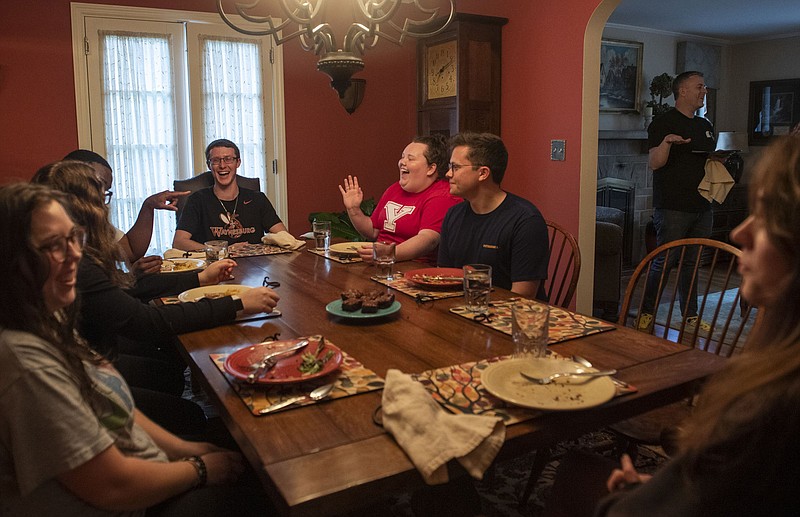 Members of the Pittsburgh Fellows program talk and laugh as they finish dinner at the home of Julie McCormick, the director of the Pittsburgh Fellows program in Sewickley, Pa.
(Pittsburgh Post-Gazette/TNS/Emily Matthews)