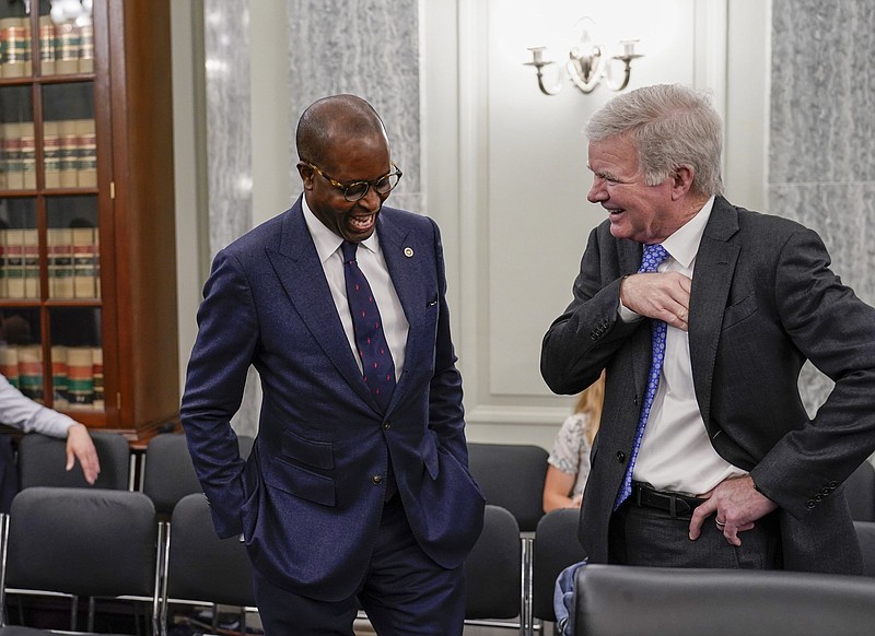 NCAA President Mark Emmert (right), seen here on June 9 speaking to Howard University President Wayne A. I. Frederick, said that the goal of the NCAA is to align authority and responsibilities among campuses, conferences and the national level.
(AP/J. Scott Applewhite)