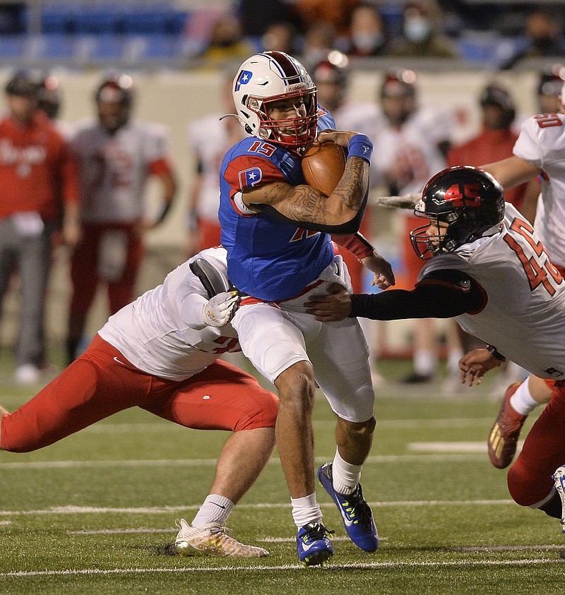 Parkview quarterback Landon Rogers (center) pulls away from Searcy linebacker Zimri Anderson (45) during Friday night's game at War Memorial stadium in Little Rock. More photos at arkansasonline.com/1114searcyparkview..Special to the Democrat-Gazette/JIMMY JONES