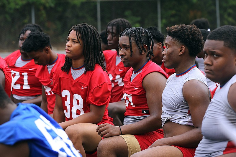 Little Rock Parkview players listen to head coach Brad Bolding at the end of the Patriots' first practice on Monday, Aug. 2, 2021, at Parkview High School in Little Rock. (Arkansas Democrat-Gazette/Thomas Metthe)