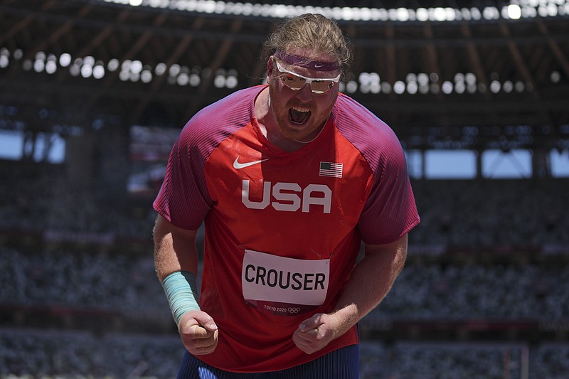 Ryan Crouser of the United States reacts after winning gold medal in the men’s shot put today at the Olympics in Tokyo. Crouser is a volunteer assistant coach with the track and field program at the University of Arkansas.
(AP/Matthias Schrader)