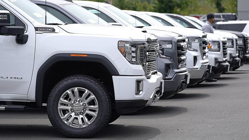 GMC pickups line a sales lot at the Albrecht Auto Group dealership on Tuesday in Wakefield, Mass.
(AP/Charles Krupa)