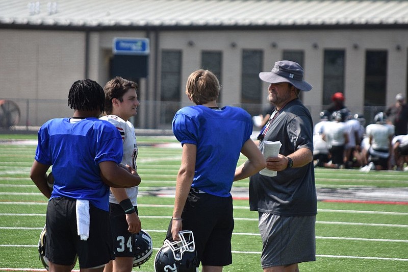 White Hall High School Coach Bobby Bolding talks with quarterbacks following practice Wednesday at Bulldog Stadium.
(Pine Bluff Commercial/I.C. Murrell)