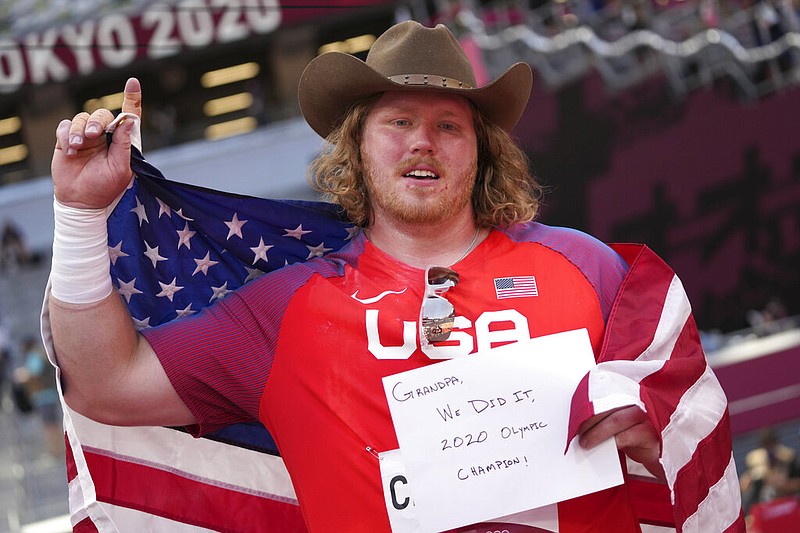 Ryan Crouser, of the United States, celebrates after winning the final of the men's shot put at the 2020 Summer Olympics, Thursday, Aug. 5, 2021, in Tokyo. (AP/Matthias Schrader)