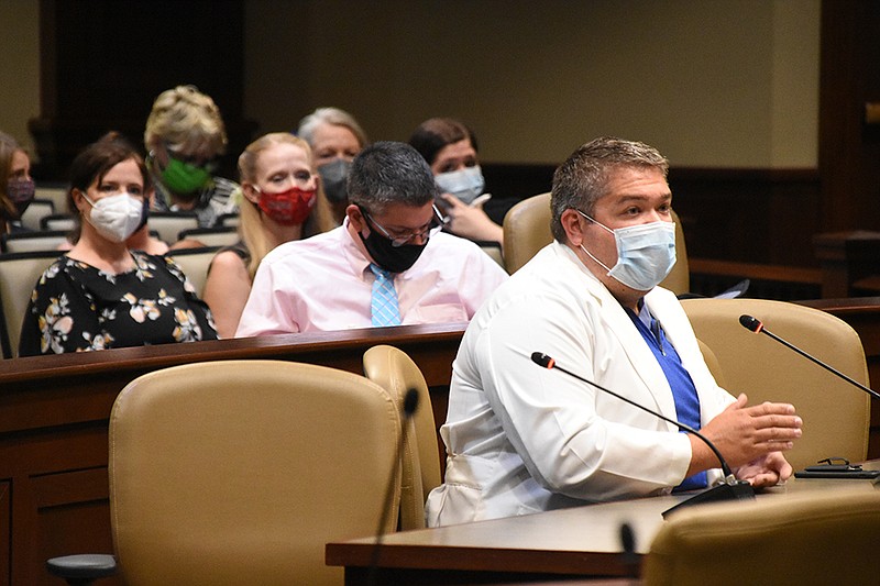 Jared Beavers, a local pediatrician, speaks in favor of HB1004 during the House Public Health, Welfare and Labor Committee meeting Thursday, Aug. 5, 2021 at the state Capitol in Little Rock. The bill would authorize schools to implement a face covering requirement..(Arkansas Democrat-Gazette/Staci Vandagriff)