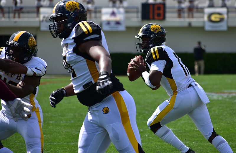 UAPB quarterback Skyler Perry (right) rolls right for a pass in May during the SWAC championship game in Jackson, Miss. 
(Pine Bluff Commercial/I.C. Murrell)