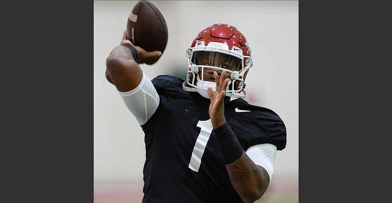 Arkansas quarterbacks KJ Jefferson (shown) and Malik Hornsby are slated to take roughly 50 snaps apiece during the first lengthy tackling session of fall camp this morning at Reynolds Razorback Stadium in Fayetteville. Jefferson will guide the first-team offense, and Hornsby will direct the second team. More photos at arkansasonline.com/814uapractice/
(NWA Democrat-Gazette/Andy Shupe)
