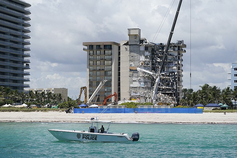 A Miami-Dade County Police boat patrols in front of the Champlain Towers South condo building after the building partially collapsed in Surfside, Fla.
(AP/Mark Humphrey)