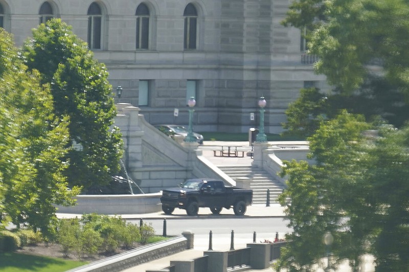 A pickup is parked on the sidewalk in front of the Library of Congress' Thomas Jefferson Building, as seen from a window of the U.S. Capitol, Thursday, Aug. 19, 2021, in Washington. (AP/Alex Brandon)