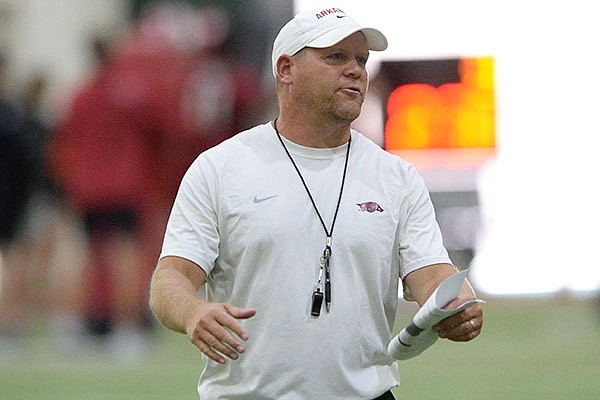 Arkansas defensive coordinator Barry Odom speaks to his players Friday, Aug. 13, 2021, during practice in the Willard and Pat Walker Pavilion in Fayetteville.