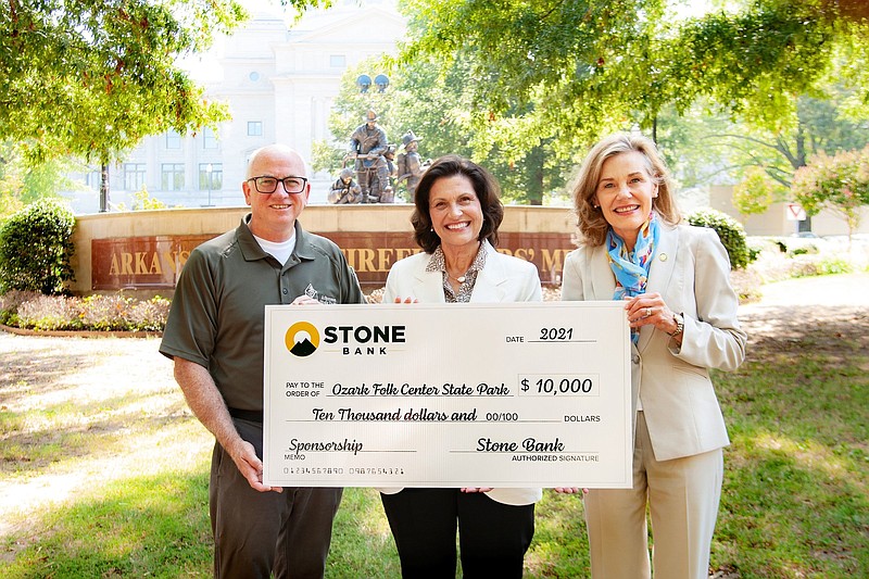 Stone Bank presents $10,000 to Arkansas State Parks. The presentation included Arkansas State Parks Director Grady Spann (from left), Stone Bank Chief Executive Officer Marnie Oldner and Arkansas Department of Parks, Heritage and Tourism Secretary Stacy Hurst. 
(Special to The Commercial)