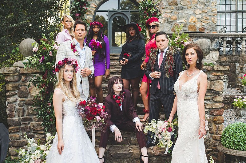 Models..Burgundy suit - Michaela Boothby (seated) with (clockwise):..Wedding gown, flower crown, blonde - Samantha Anderson.Chase Rackley.Pink men's shirt dress, black belt, black boots - Erica Watkins.Purple men's shirt dress, flower crown - Kyla Dishman.Black men's shirt dress, black hat - Stacy Heath.Red men's shirt dress, red beret - Kiley Salge.Joshua Ang Price.Wedding gown, darker hair, arm wrap and bouquet - Alyson Perry..at the first-of-its-kind Fleur de Muse, a virtual design show for Sunday, August 8, 2021..(Special to the Democrat-Gazette -- Sydney Rasch).