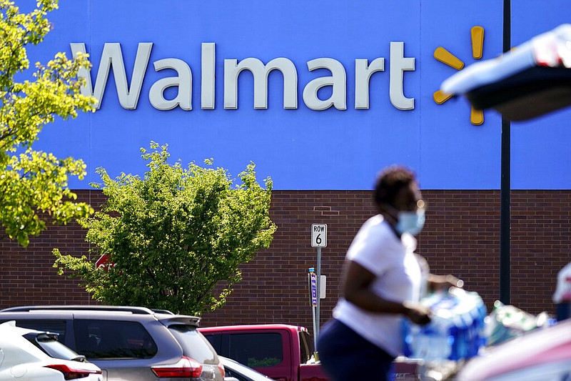 A shopper loads items into her car in the parking lot of a Walmart in Willow Grove, Pa., Wednesday, May 19, 2021. (AP/Matt Rourke)