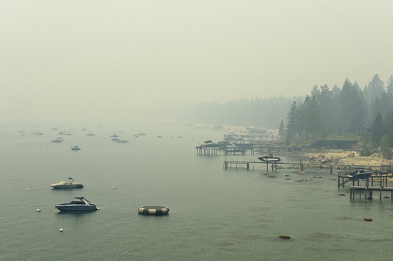 Smoke from the Caldor Fire in California covers Lake Tahoe in the Incline, Nev., area on Tuesday, Aug. 24, 2021. (Andy Barron/The Reno Gazette-Journal via AP)