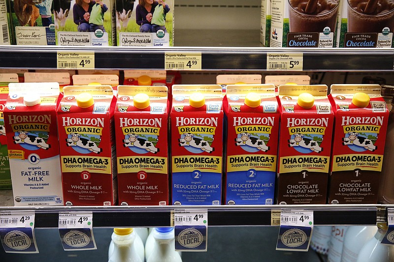 Horizon Organics milk lines the shelves at Alfalfa’s Market in Boulder, Colo. Horizon Organics’ parent, Danone, will concentrate its business on farms in the West and Midwest, starting next year.
(AP)
