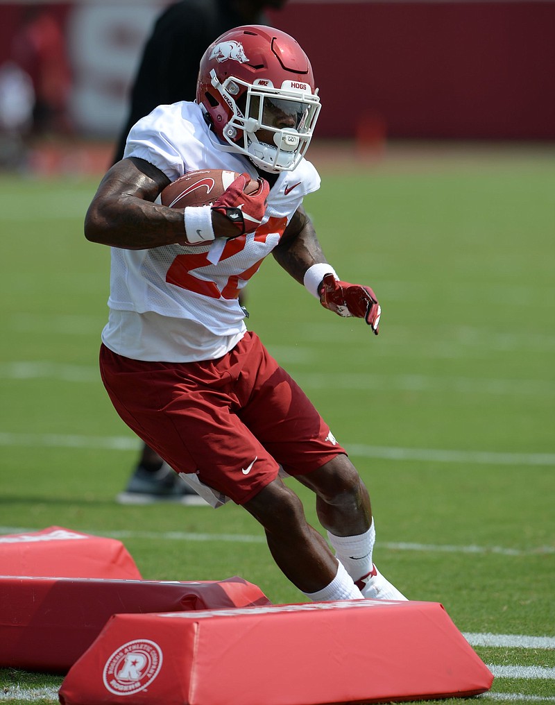 Arkansas junior running back Trelon Smith, shown during a practice earlier this month, was part of a large group of players in no-contact jerseys during Thursday’s practice.
(NWA Democrat-Gazette/Andy Shupe)