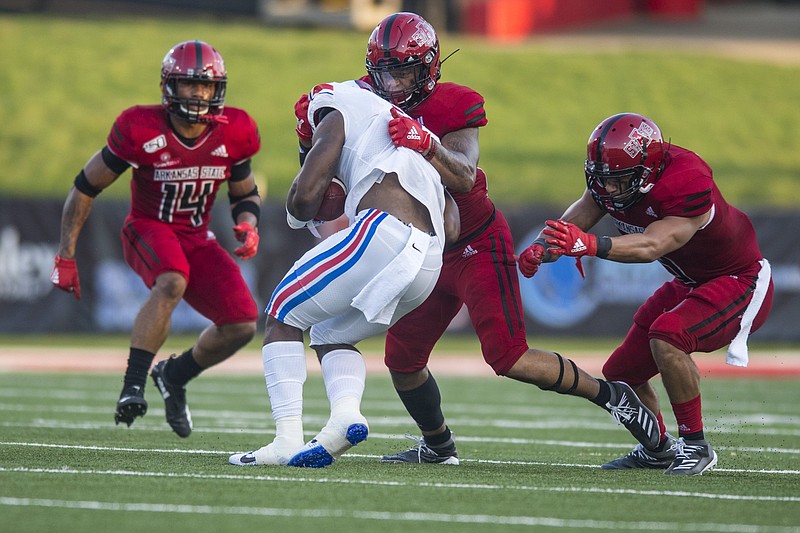 Arkansas State senior linebacker Caleb Bonner (center top) is a consistent performer who Coach Butch Jones said he can rely upon in his first season with the Red Wolves.
(Democrat-Gazette file photo)