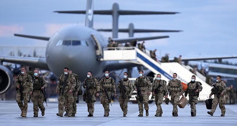 German soldiers arrive on a plane from Tashkent, Uzbekistan, at the Bundeswehr airbase Friday in Wunstorf, Germany, after they finished the evacuation mission in Kabul, Afghanistan.
(AP/Martin Meissner)