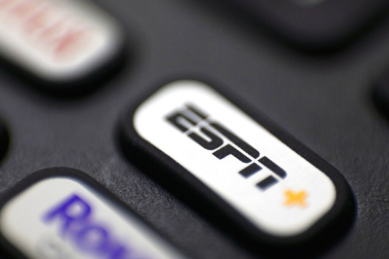 A logo for ESPN is shown on a remote control in Portland, Ore., in this Aug. 13, 2020, file photo. (AP/Jenny Kane)