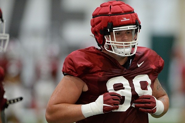 Arkansas defensive lineman John Ridgeway moves Tuesday, Aug. 17, 2021, while taking part in a drill during practice at the university practice facility in Fayetteville.