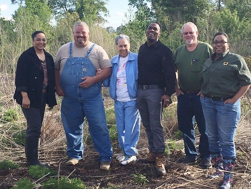 Participants in the University of Arkansas at Pine Bluff’s Keeping it in the Family Program to help them retain their family land in stand with each other. Those involved in Ouachita County (from left) were Kandi Williams, UAPB Extension associate; Aaron Williams, Poison Spring State Forest manager; Ouachita County landowners Sara Seals and George Seals; Joe Friend, UAPB forester; and Evette Browning, outreach coordinator for the Arkansas Department of Agriculture. 
(Special to The Commercial)