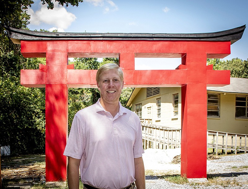 John Mark Goings stands in front of a Torii Gate that will mark the entrance of Wabi Sabi After Dark, an Oct. 1 fundraiser for Camp Aldersgate.
(Arkansas Democrat-Gazette/Cary Jenkins)