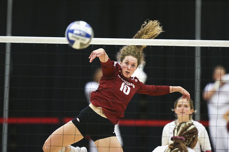 Arkansas outside hitter Jillian Gillen (10) spikes, Saturday, August 28, 2021 during a volleyball game at Barnhill Arena in Fayetteville. (NWA Democrat-Gazette/Charlie Kaijo)