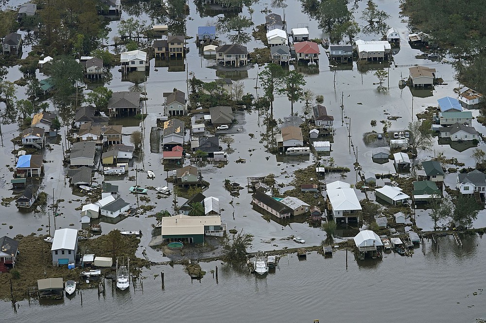 Floodwaters slowly recede Wednesday in Lafitte, La. Officials have been waiting for the water to go down enough for food, water and repair supplies to be trucked into Lafitte and other low-lying areas in hard-hit Jefferson Parish.
(AP/Gerald Herbert)