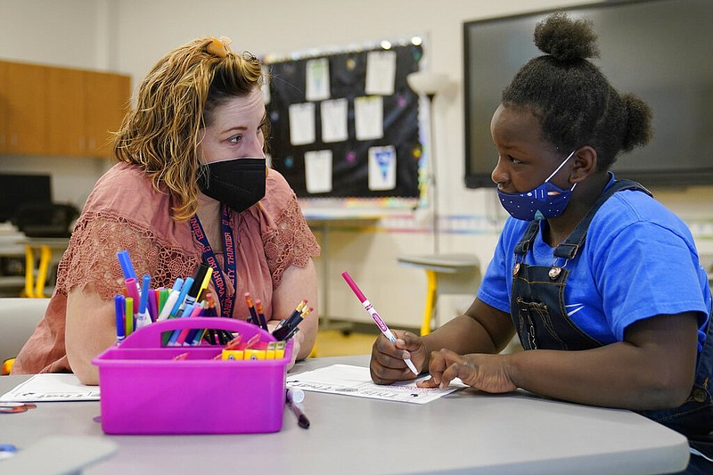 Teacher Amanda Martinez works one-on-one with a third-grade student at Positive Tomorrows, an Oklahoma City school exclusively for students in families experiencing homelessness, in this Aug. 17, 2021, file photo. (AP/Sue Ogrocki)