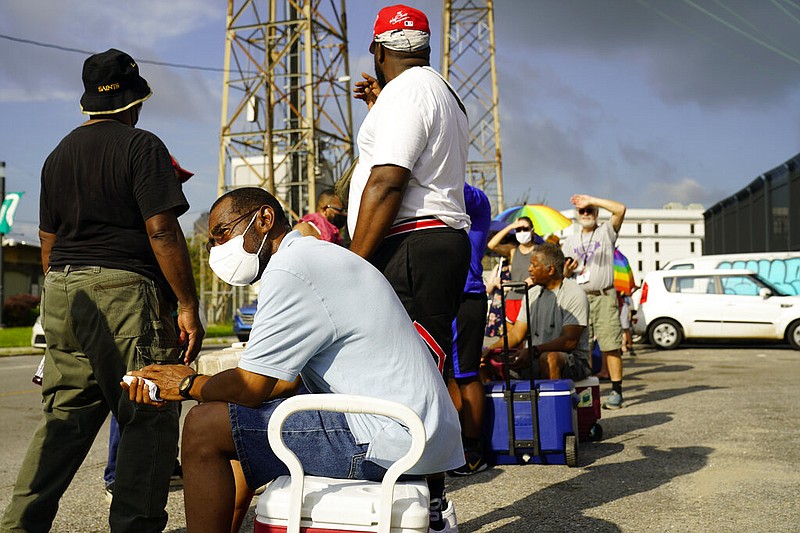 In the aftermath of Hurricane Ida people lining up for food and ice at a distribution center Wednesday, Sept. 1, 2021, in New Orleans, La. (AP/Eric Gay)