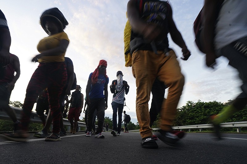 Haitian migrants walk Thursday morning along the highway in Huixtla, in Mexico’s southernmost state of Chiapas, in their journey north toward the U.S.
(AP/Marco Ugarte)