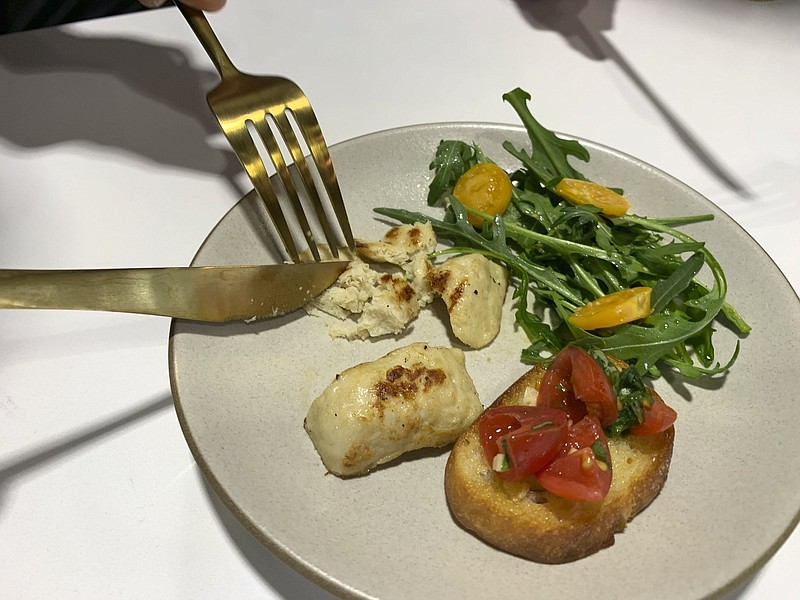 Grilled chicken produced in a Memphis Meats laboratory in Emeryville, Calif., is displayed in this 2019 file photo.
(AP)