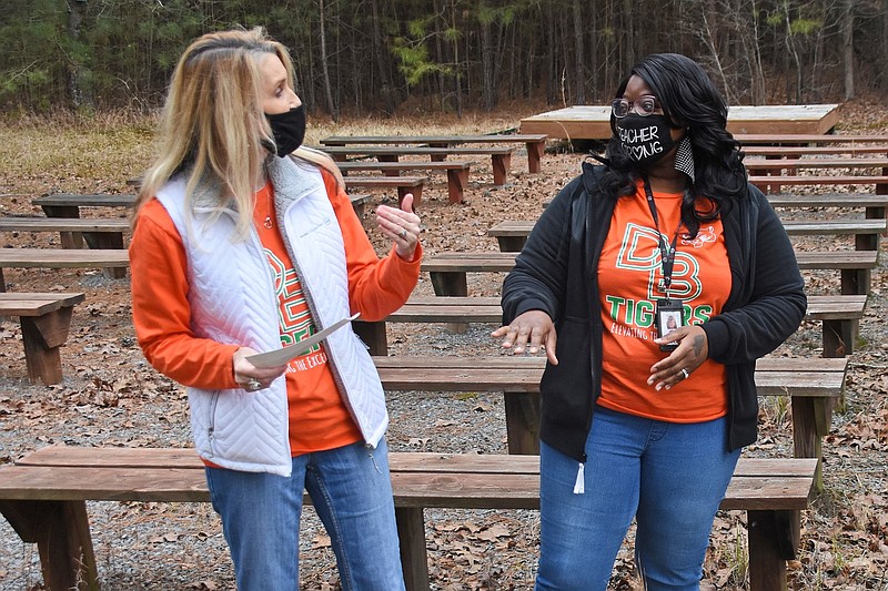 Daisy Bates Elementary School teachers Lisa Davis (left) and Larisha Nelson discuss plans for an outdoor classroom in Little Rock in this Jan. 20, 2021, file photo. The two received a Conservation Education Grant from the Arkansas Game and Fish Commission in partnership with Arkansas Rural Development Commission and the Department of Commerce Division of Rural Services. The teachers planned to use the funds to enhance education programs focused on fish, wildlife and conservation. (Arkansas Democrat-Gazette/Staci Vandagriff)