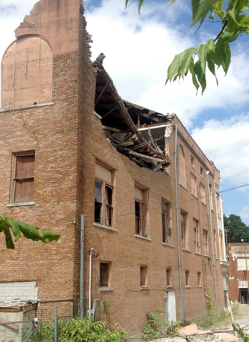 One of Go Forward Pine Bluff’s initiatives is to revive downtown by removing blight and restoring dilapidated historical buildings. The top floor at the rear of the vacant, three-story Shriner Building at 602 Main St. in Pine Bluff collapsed in July 2014. 
(Arkansas Democrat-Gazette file)
