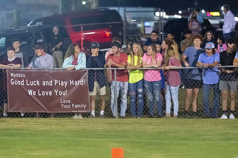 Fans gather up close along the fences to get a good view of an Alabama high school football game between Jemison and Thorsby, Ala., at Thorsby in this Aug. 20, 2020 file photo. (AP/Vasha Hunt)