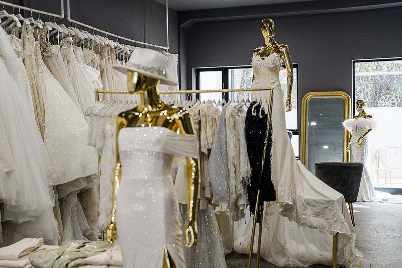 These dresses are seen at Pantora Bridal in New York in August. After postponing their weddings for months, brides are storming ateliers looking for gowns in a hurry.
(The New York Times/Gabriela Bhaskar)
