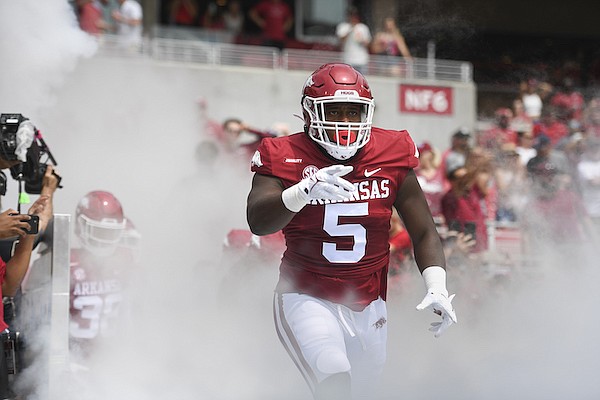 Arkansas defensive end Dorian Gerald runs onto the field prior to a game against Rice on Saturday, Sept. 4, 2021, in Fayetteville.