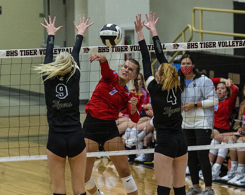 Olivia Melton (7) with the kill against Gloria Cranney (9) and Audree Stanphill (4) of Bentonville at Bentonville High School, Bentonville, AR, on Tuesday, September 7, 2021. (Special to NWADG/David Beach)